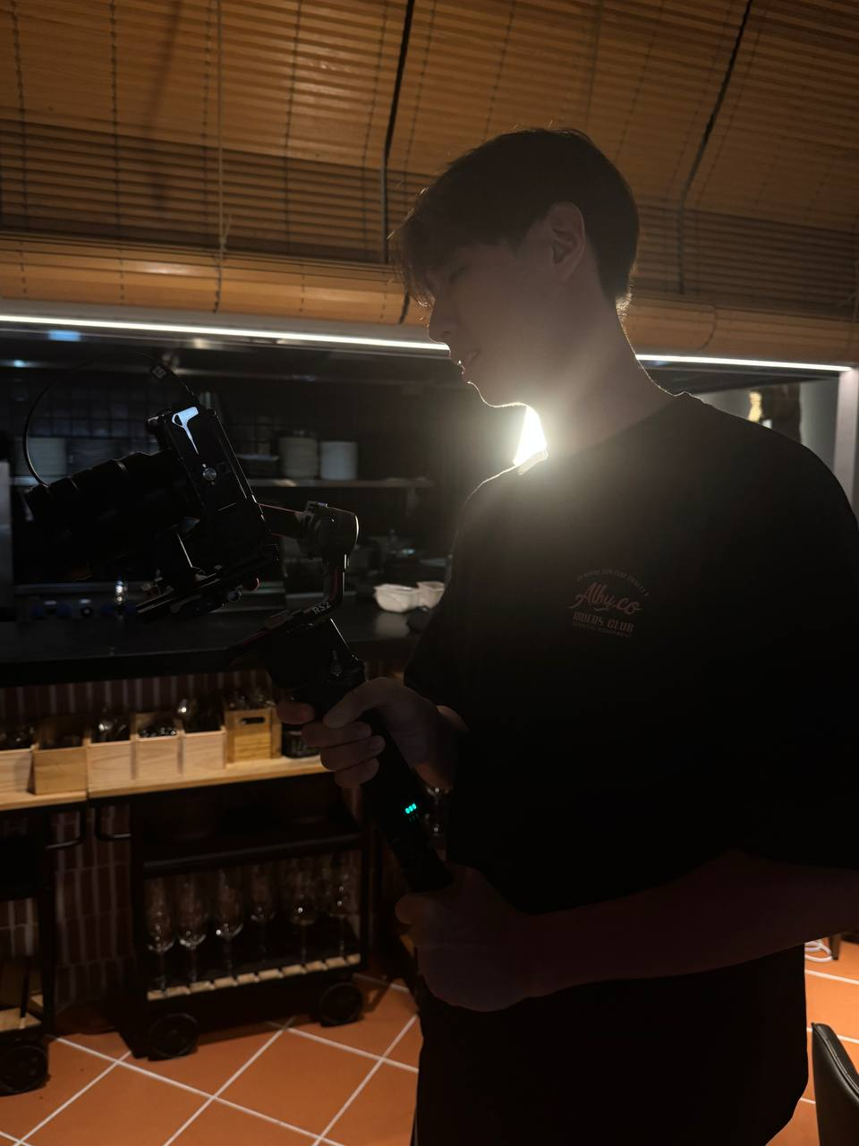 Operating a camera gimbal in a dimly lit dining room